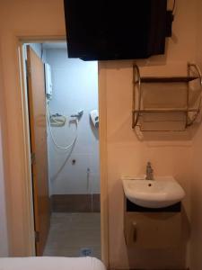 a bathroom with a sink and a shower at Golden Leaf Hotel Danga Bay in Johor Bahru