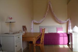 Postel nebo postele na pokoji v ubytování La Maison de Lestang + 3 fotografie