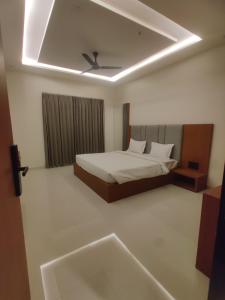Hotel Pride Of Chittor客房内的一张或多张床位