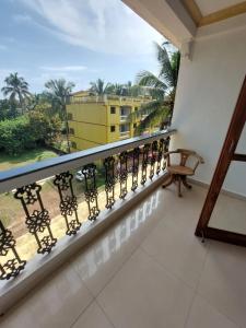 a balcony with a view of a building at Royal Reosrt Rajbag in Canacona