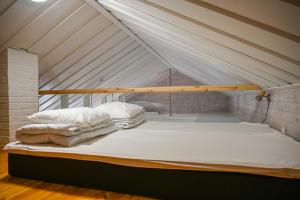 a bed with two pillows on it in a tent at Rukajärven Lomamajat Cottage 3 in Kuusamo