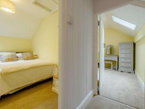 a bedroom with a bed and a dresser at 2 bed property in Llandysul 88775 in Llanfihangel-ar-Arth