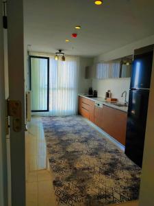 a kitchen with brown cabinets and a large window at Luxury apartment in Istanbul