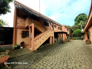 a building with a staircase on the side of it at LA MARINA 3 in Ambodifototra +2 photos