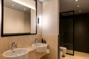 Bany a Hotel Le Dune Piscinas