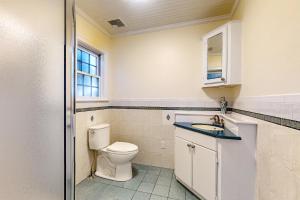 a bathroom with a toilet and a sink at Bianca in Gloucester +28 photos