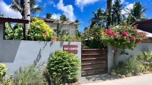 a new house with flowers on a wall at Yay Lodge SIARGAO, private room 2 with AC & hot shower and fast Starlink Wifi in General Luna