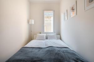 Posteľ alebo postele v izbe v ubytovaní Liget Apartment