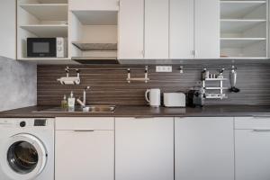 Kuchyňa alebo kuchynka v ubytovaní Liget Apartment