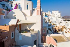 a view of a village with white buildings at Marble Sun Villa with Jacuzzi by Caldera Houses in Oia