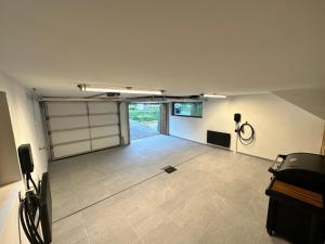 a room with a garage with a door at Chalets ASA 426 m2 in Chamonix-Mont-Blanc