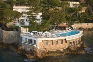 an aerial view of a house in the water at Hotel Cap Estel in Èze