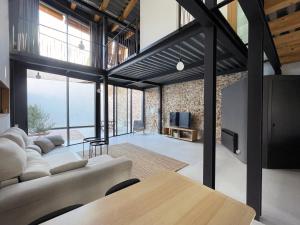 a living room with a couch and a table at villa en el penedès in Gornal