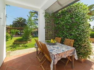 a table and chairs on a patio at Appartamenti Adriana di ArgonautiVacanze in Porto Azzurro +77 photos