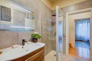 a bathroom with a sink and a shower at La Valbinella Few Meters From Varese Lake - Happy Rentals in Gavirate +24 photos