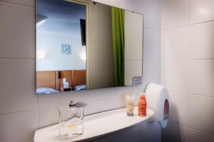 Koupelna v ubytování Hôtel Compostelle