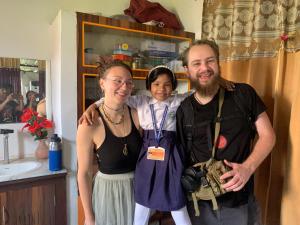 a man and woman posing for a picture in a bathroom at Sarkar Villa Homestay in Kolkata