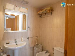 a bathroom with a sink and a toilet at Apartamento Sky Blue in Colònia de Sant Jordi