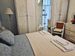 a bedroom with a bed with two towels on it at Appartamento Citara in Ischia