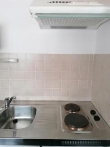 Kuchyňa alebo kuchynka v ubytovaní Apartmány 670 pod Lysou horou