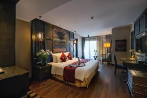 Postel nebo postele na pokoji v ubytování Lotus Aroma Sapa Hotel