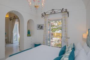 Postel nebo postele na pokoji v ubytování Milky Suites Positano
