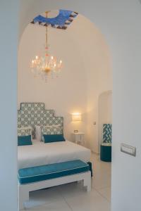 Postel nebo postele na pokoji v ubytování Milky Suites Positano