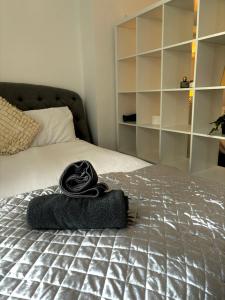 a pair of towels sitting on top of a bed at The Santiago Suite - sleeps 10 in Southport