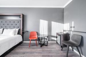 Postel nebo postele na pokoji v ubytování Hotel Aska