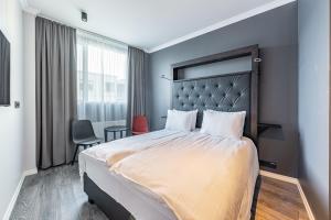 Postel nebo postele na pokoji v ubytování Hotel Aska
