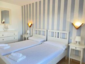 Postel nebo postele na pokoji v ubytování Pregonda - Apartamento con piscina y junto a playa + 23 fotografií