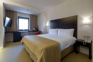 Postel nebo postele na pokoji v ubytování Ramada Plaza by Wyndham Bucharest Convention Center