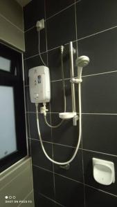 a shower in a bathroom with a urinal at HB1511-Cyberjaya-Netflix-Wifi-Parking-Pool , 3089 in Cyberjaya