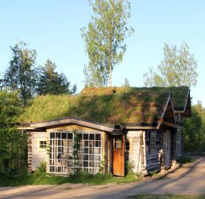 an old house with a grass roof at Valonranta Cottage in Saarijärvi