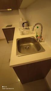 a sink in a small kitchen with at HB1511-Cyberjaya-Netflix-Wifi-Parking-Pool , 3089 in Cyberjaya