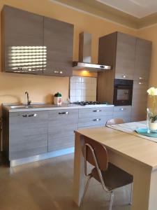 a kitchen with a table and a sink in it at Lomello_Free Wi-Fi_Netflix in Lomello