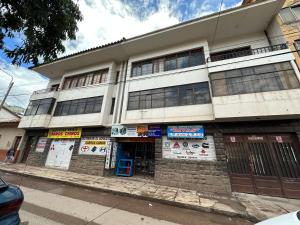 a building on the side of a street at Cusi Causay in Cusco