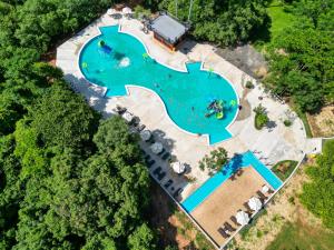 an aerial view of a large swimming pool in a park at Los Lagos Resort Hotel in Capiatá