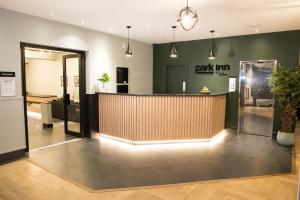 a lobby with a reception desk in a building at Park Inn by Radisson Bournemouth in Bournemouth
