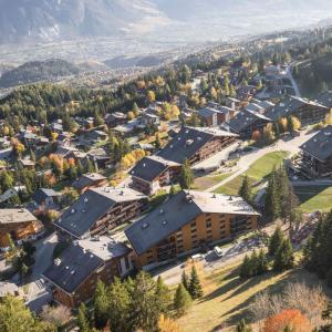 an aerial view of a small town with buildings at Anzère, appartement cozy au coeur des Alpes in Anzère