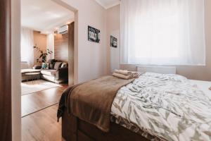 Posteľ alebo postele v izbe v ubytovaní Oliver Apartman