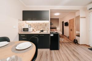 Kuchyňa alebo kuchynka v ubytovaní Oliver Apartman
