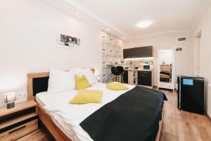 Posteľ alebo postele v izbe v ubytovaní Oliver Apartman