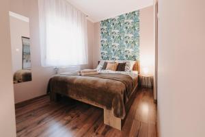 Posteľ alebo postele v izbe v ubytovaní Oliver Apartman