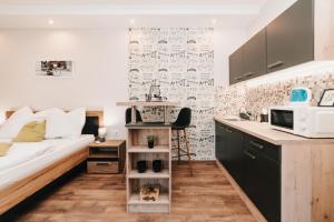 Kuchyňa alebo kuchynka v ubytovaní Oliver Apartman