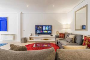 A television and/or entertainment centre at Royal Palace by SkyKey