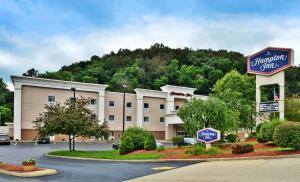 a hotel building with a sign in front of it at Wingate by Wyndham Steubenville in Steubenville