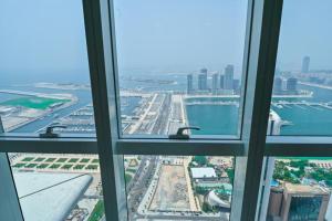 an airport view from the window of a building at 54 Floor Palm & Sea View Dubai Marina. LUX / NEW in Dubai