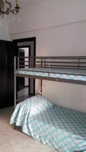 a bedroom with two bunk beds in a room at Appartamento Cavour 15 in Bogliasco