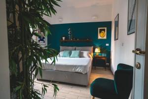a bedroom with a bed and a green wall at Vaticano/Trastevere Floreal Suite in Rome